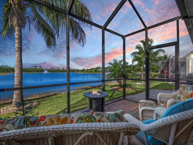 unfurnished sunroom featuring a water view