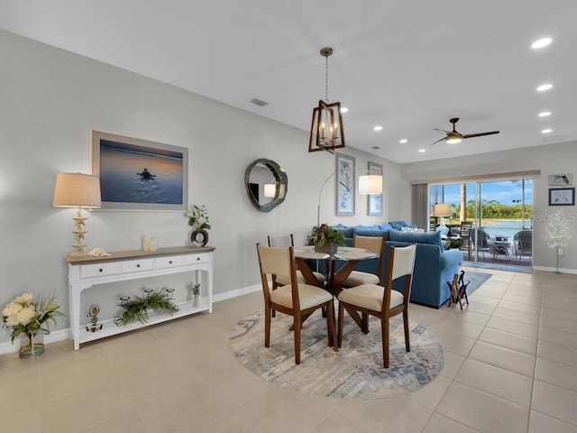 dining room with light tile patterned floors and ceiling fan