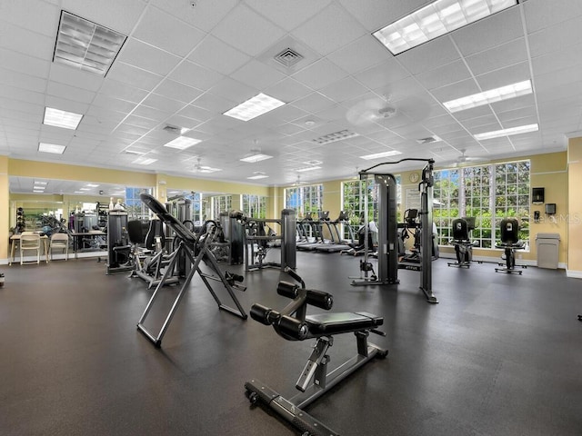 exercise room featuring a paneled ceiling