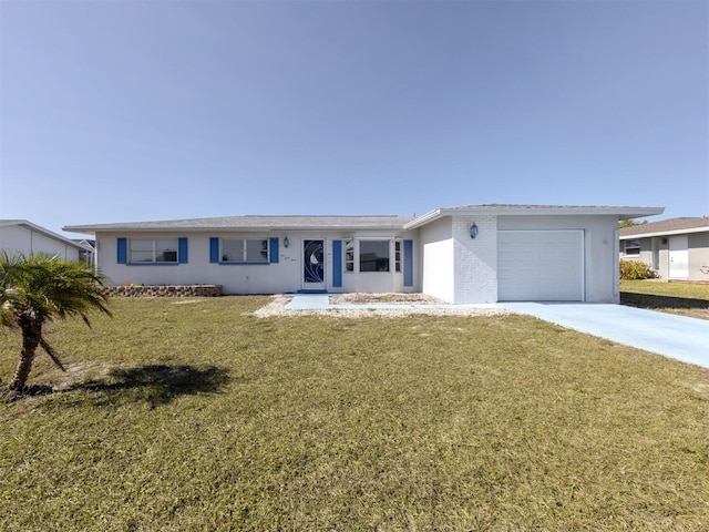 ranch-style home with a garage and a front lawn