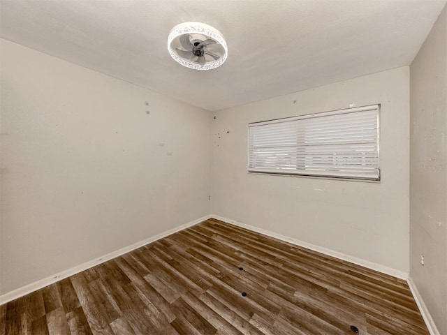 empty room with dark hardwood / wood-style floors