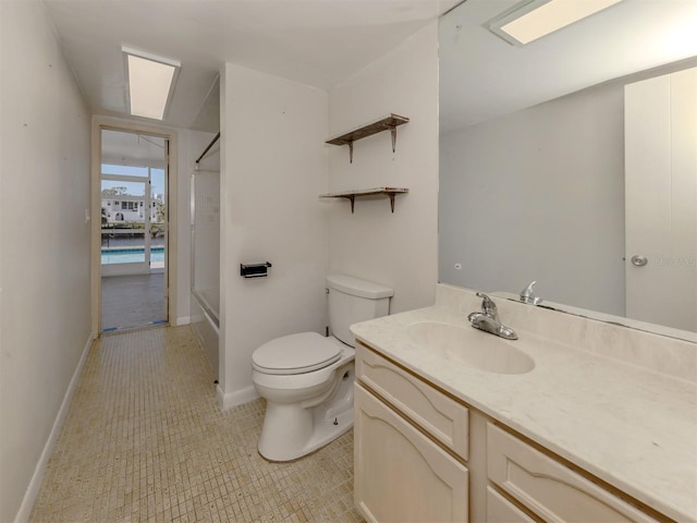 bathroom with walk in shower, vanity, and toilet