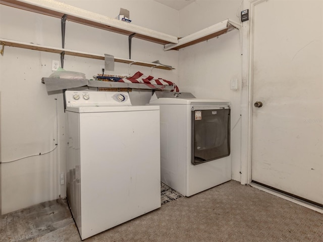 laundry area featuring washing machine and clothes dryer