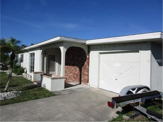 view of property exterior with a garage