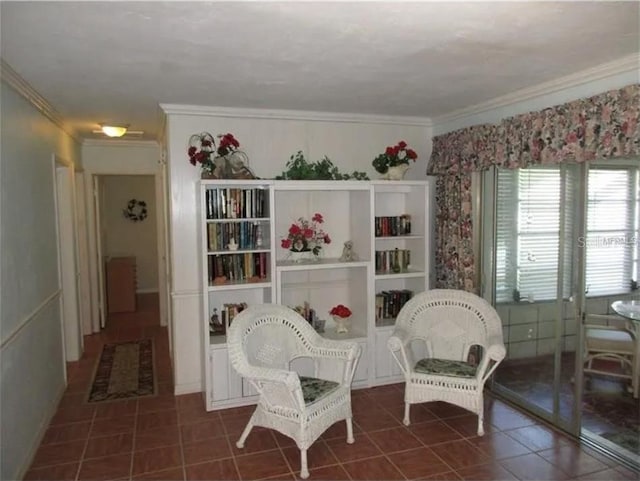 living area with dark tile patterned flooring and ornamental molding