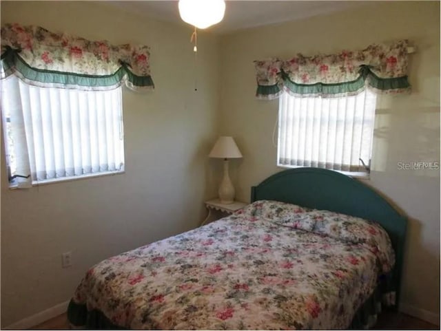 bedroom with multiple windows