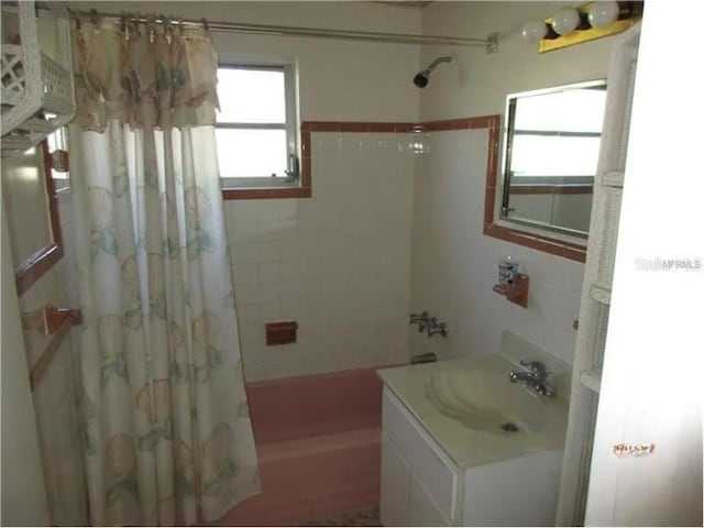 bathroom featuring vanity and shower / tub combo