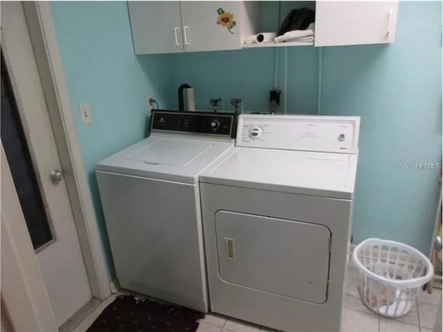 washroom with cabinets and separate washer and dryer