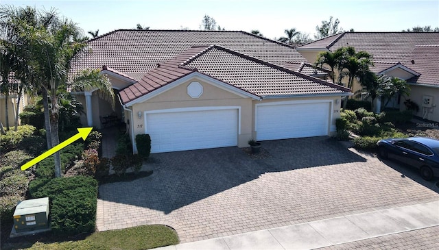 view of front of property with a garage