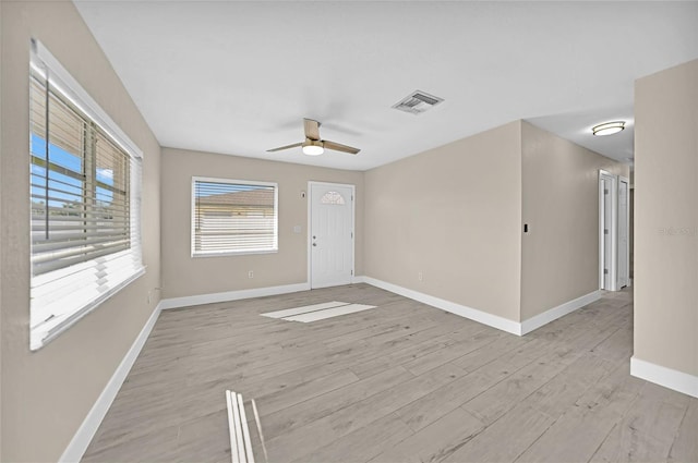 unfurnished room featuring ceiling fan and light hardwood / wood-style flooring