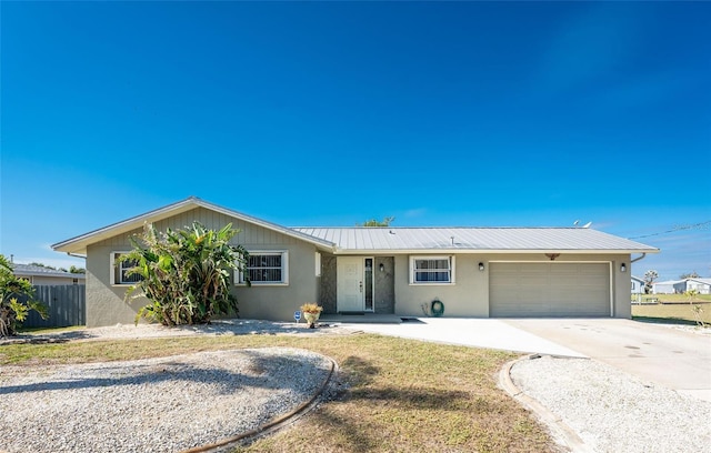 ranch-style home with a garage