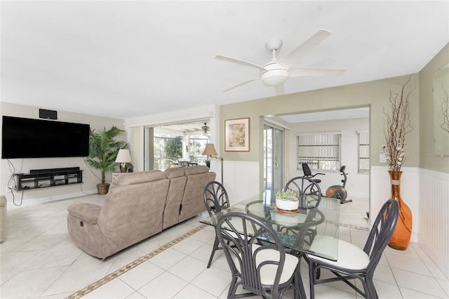 dining area with ceiling fan and light tile patterned flooring