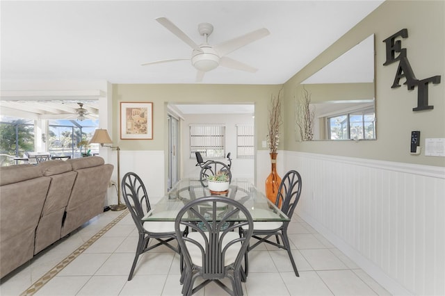 dining area featuring light tile patterned floors and ceiling fan