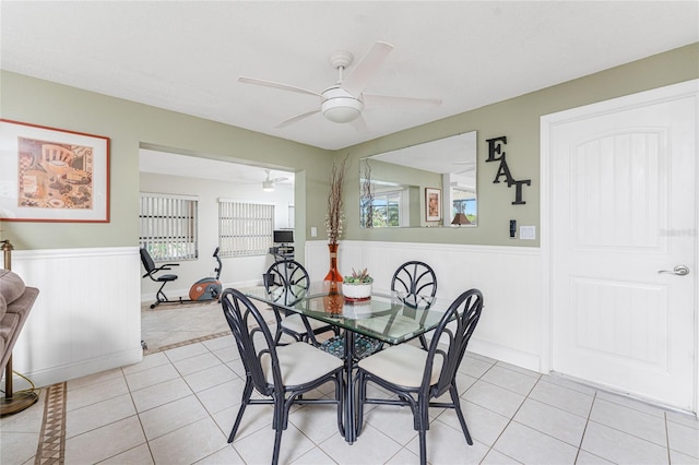 dining area featuring light tile patterned floors and ceiling fan