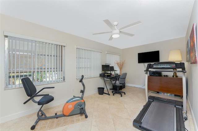 exercise room featuring ceiling fan and light tile patterned floors