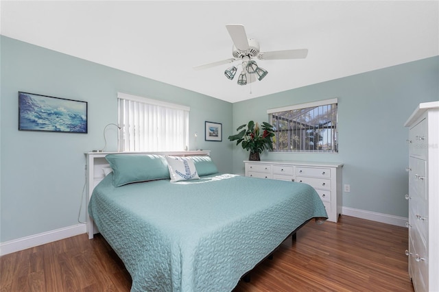 bedroom featuring ceiling fan and dark hardwood / wood-style floors