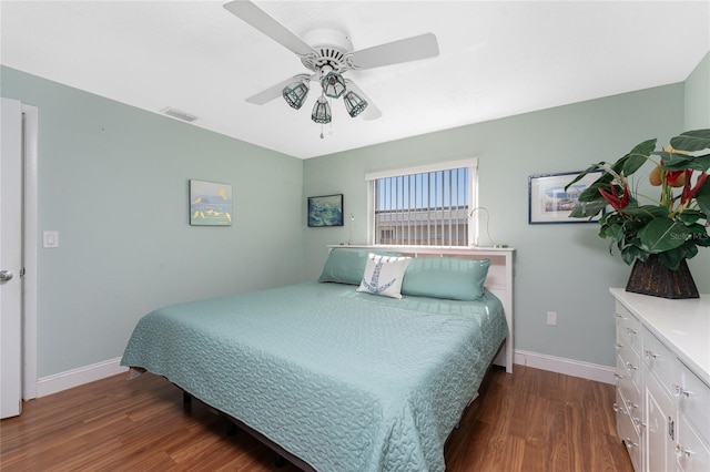 bedroom featuring ceiling fan and dark hardwood / wood-style floors