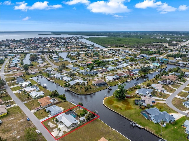 birds eye view of property featuring a water view