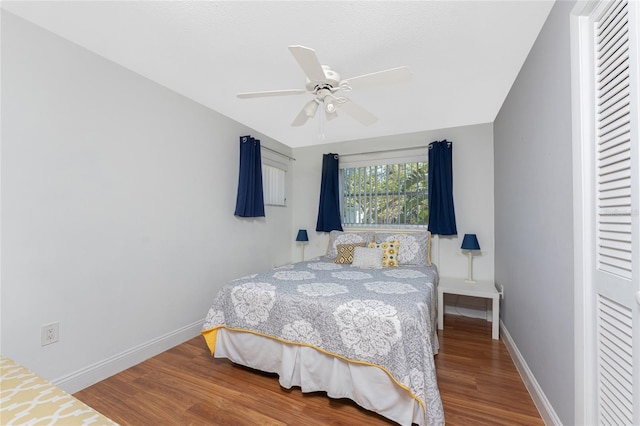 bedroom with hardwood / wood-style flooring and ceiling fan