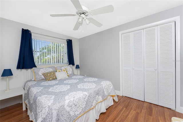 bedroom with ceiling fan, a closet, and wood-type flooring