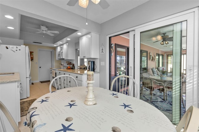 dining space featuring a tray ceiling