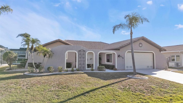 view of front of property with a front lawn and a garage