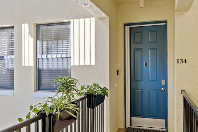 entrance to property featuring a balcony