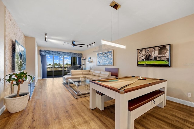 interior space with ceiling fan, track lighting, light hardwood / wood-style floors, and billiards