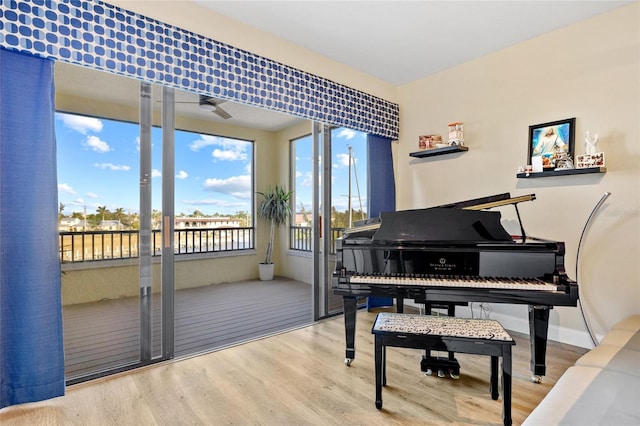 misc room with ceiling fan and hardwood / wood-style floors