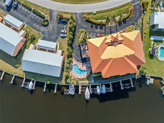 birds eye view of property with a water view