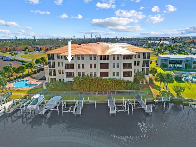 birds eye view of property featuring a water view