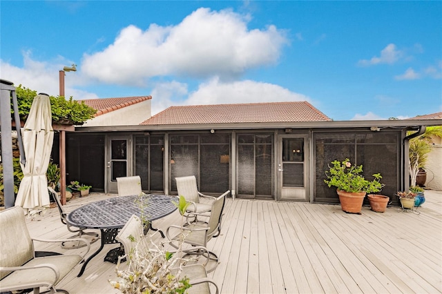 wooden terrace with a sunroom