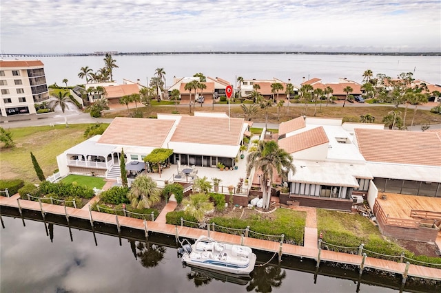 birds eye view of property with a water view