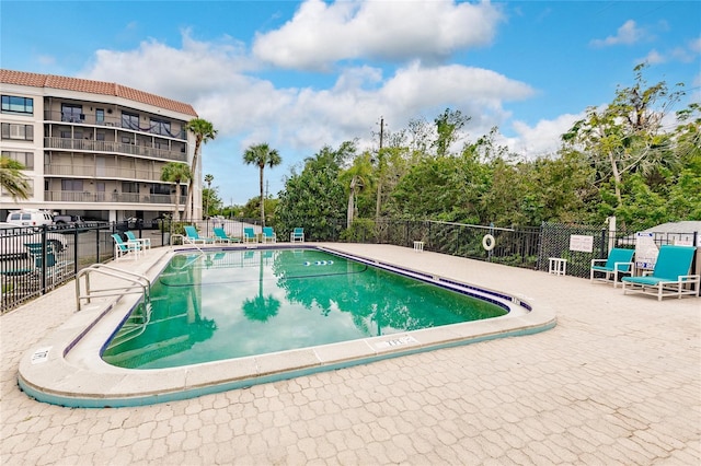 view of swimming pool with a patio