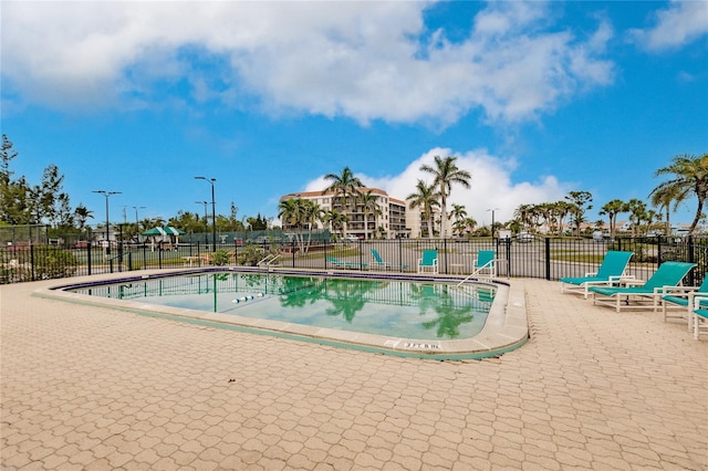 view of swimming pool with a patio area