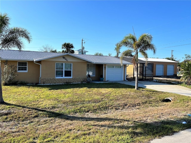 ranch-style home with a garage and a front yard