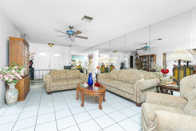 living room with light tile patterned floors and ceiling fan