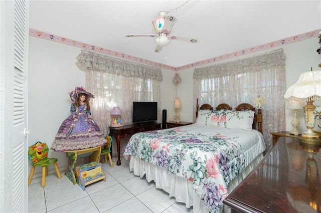 tiled bedroom with ceiling fan