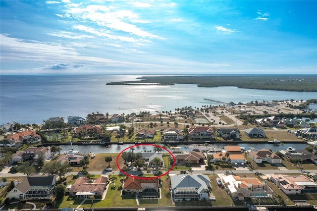 birds eye view of property with a water view