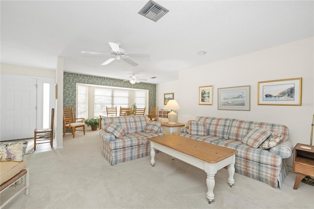 living room featuring ceiling fan and light colored carpet