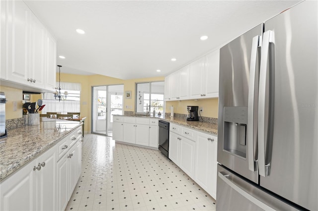 kitchen with light stone countertops, stainless steel refrigerator with ice dispenser, white cabinetry, black dishwasher, and hanging light fixtures