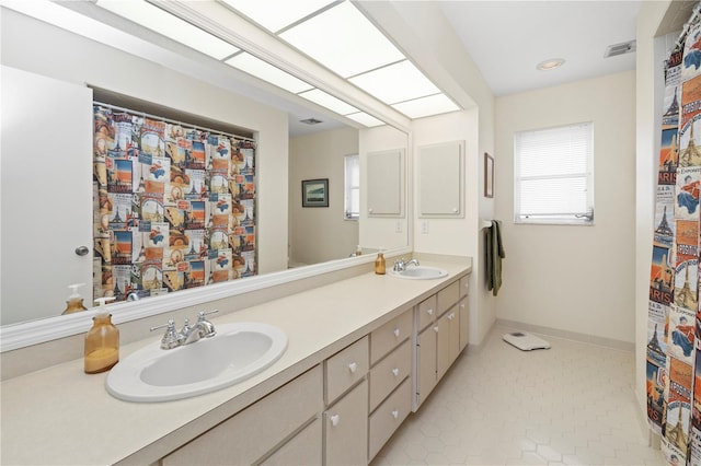 bathroom with vanity and tile patterned flooring