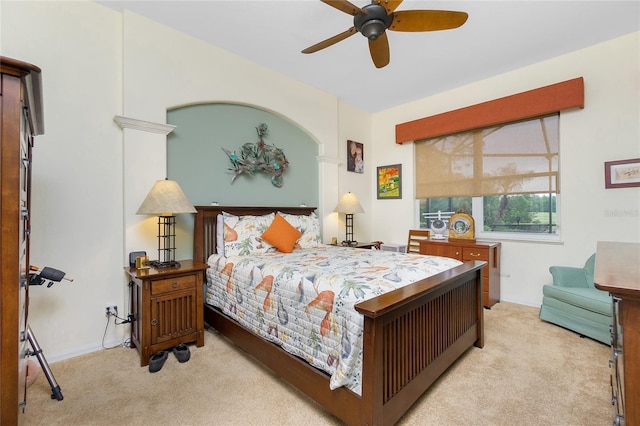 bedroom with ceiling fan and light colored carpet