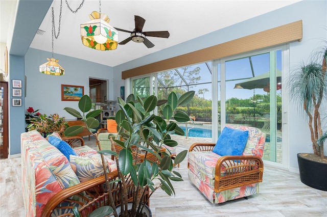 sunroom / solarium with ceiling fan