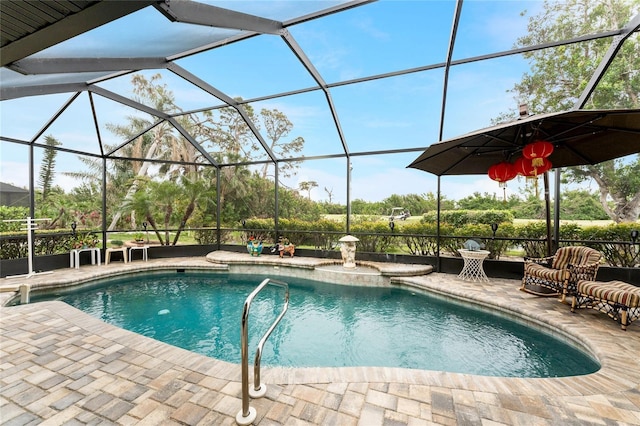 view of pool featuring a lanai and a patio