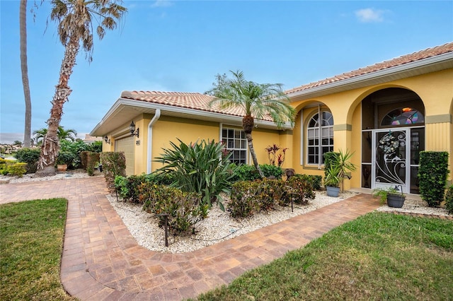 exterior space with a garage and a front yard