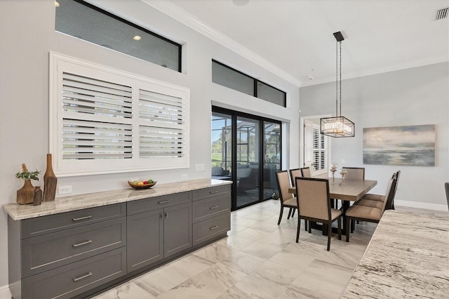 dining room featuring crown molding