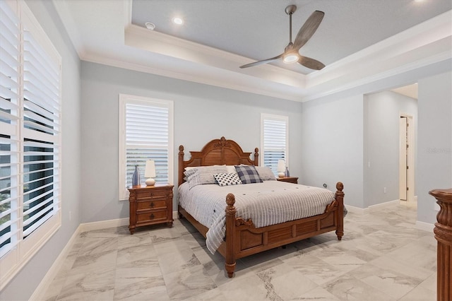 bedroom featuring a tray ceiling, ceiling fan, and ornamental molding