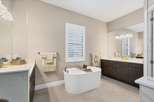 bathroom with vanity and a tub