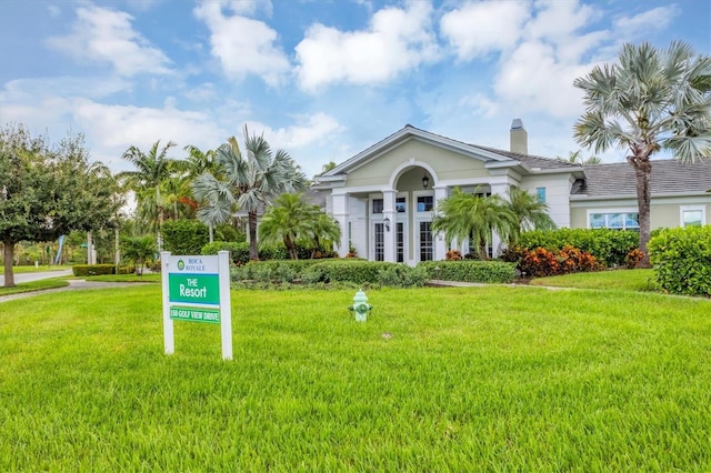 view of front of property with a front lawn